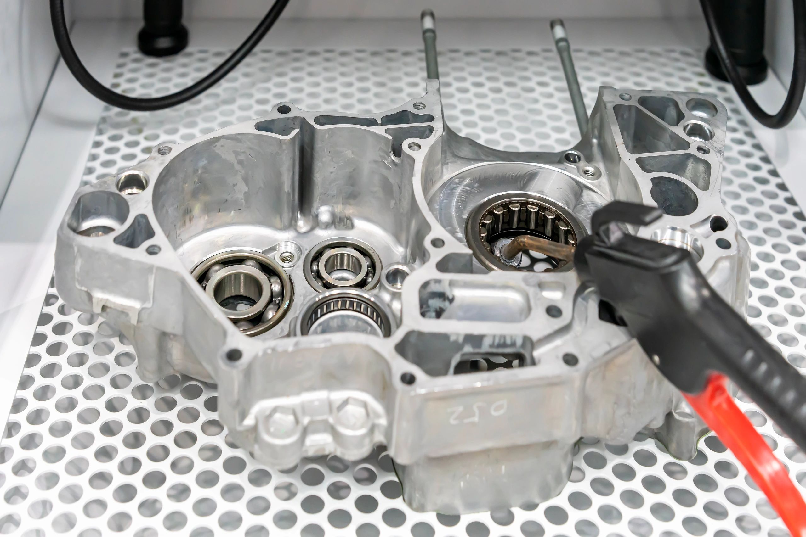 Disassembled powersport engine being repaired at Basin Powersports workshop